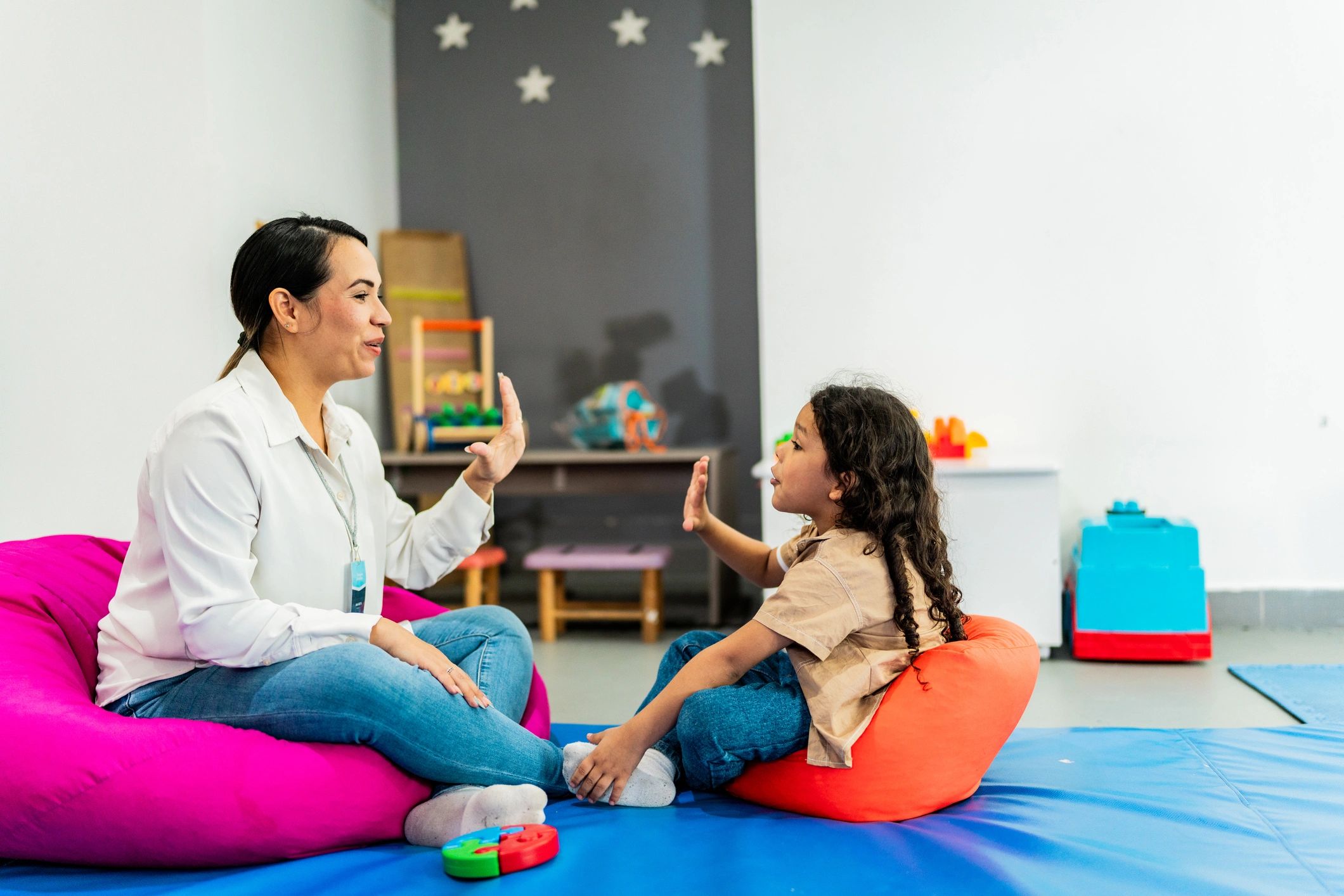 Adult supporting a child in a calm learning environment